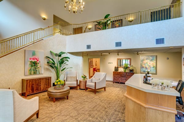 Spacious lobby with seating and decorative plants