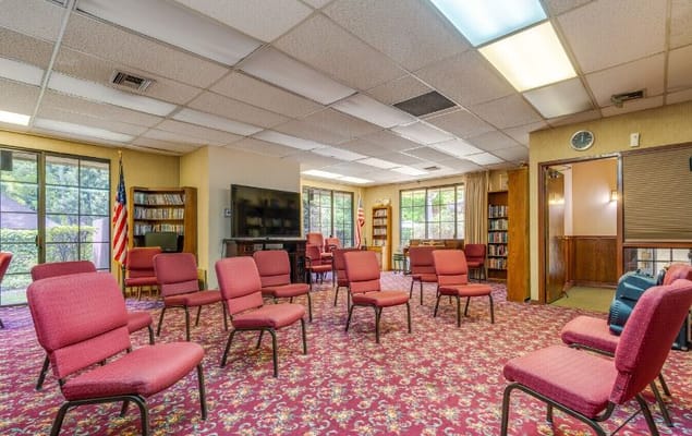 View of the common room with chairs arranged for a meeting