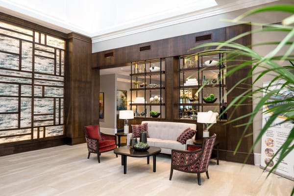 Cozy lobby space with seating and decorative shelves