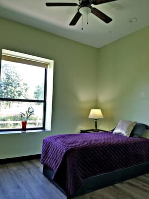 Private resident room with a bed and window