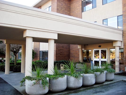 Front entrance of a care facility with planters