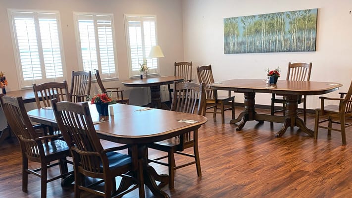 Interior view of a common area with wooden tables
