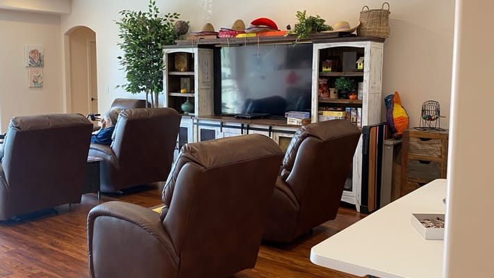 Common area with comfortable seating and a TV