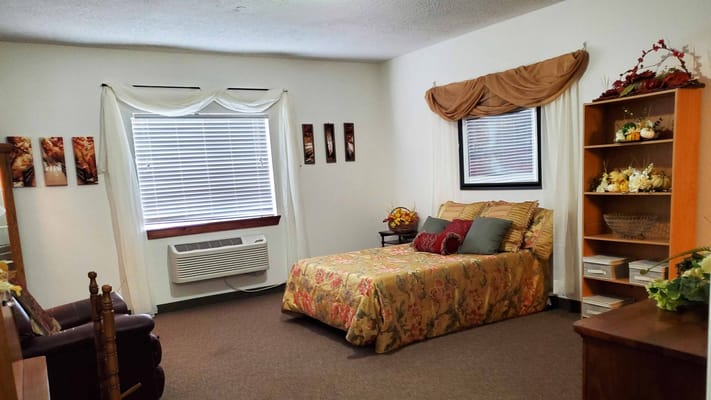 Cozy bedroom with floral bedding and decor