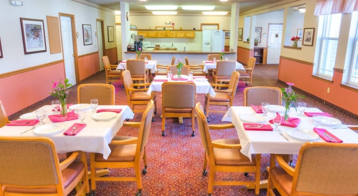 Dining area set with tables and chairs for residents