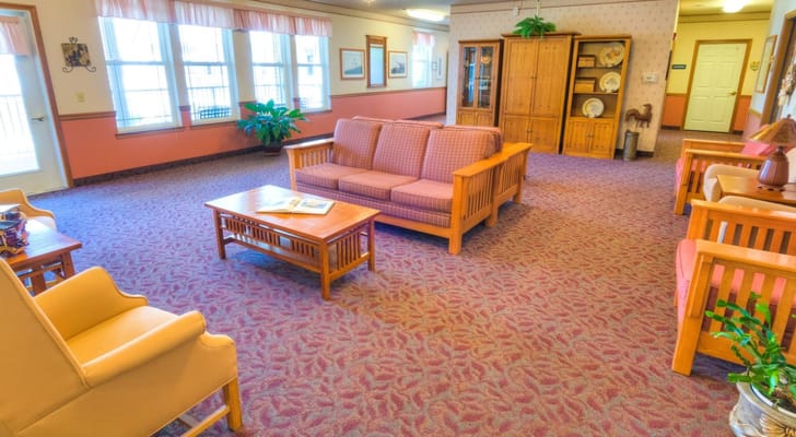 Common area with seating and decor in a nursing home
