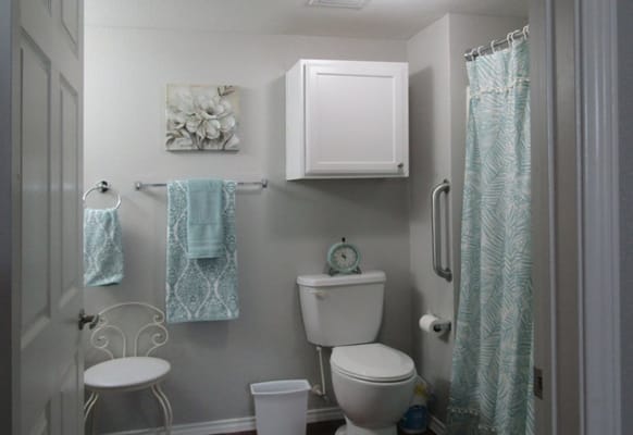 Bright bathroom with teal and white decor