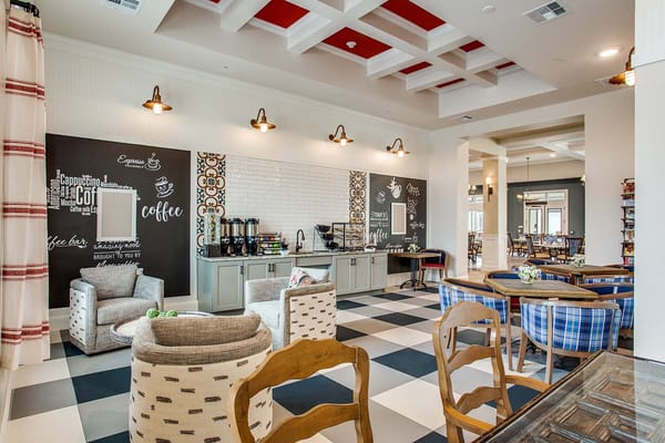 Bright common area with seating and coffee station
