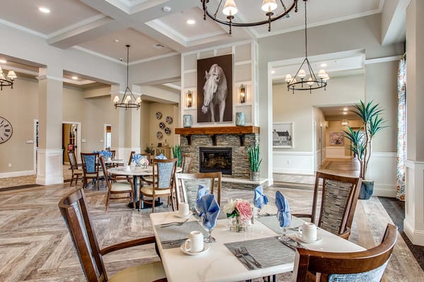Elegant dining room set for a meal with flowers