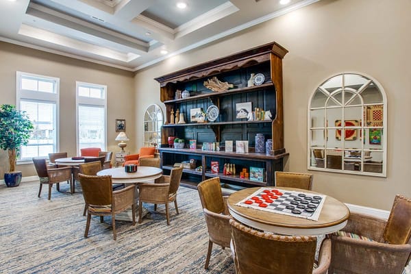 Bright common area with seating and games