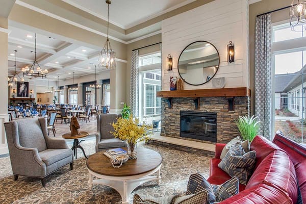 Interior common area with seating and a fireplace