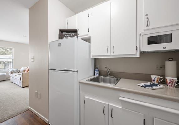 Interior view of a kitchenette area in a resident's room