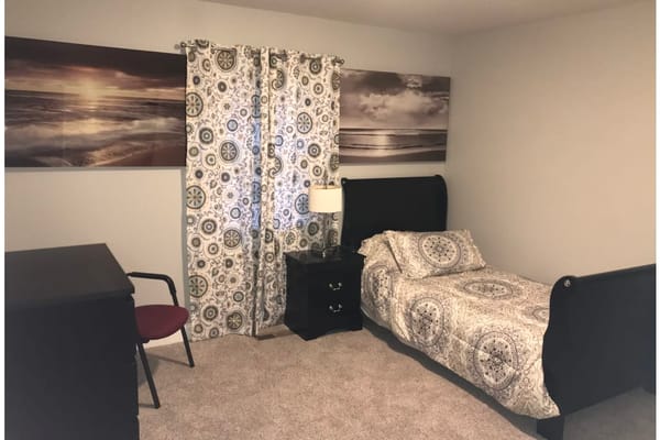 Cozy private resident room with a bed and decor