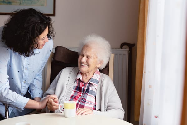 Caregiver and resident enjoying a moment together