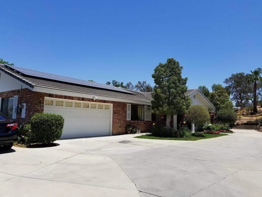 Exterior view of a residential care facility with landscaping