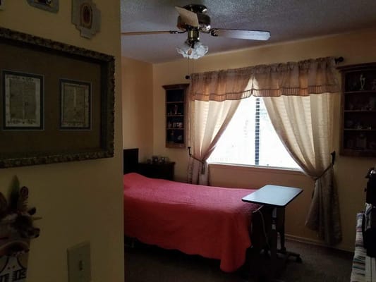 Cozy private room with a bed and window