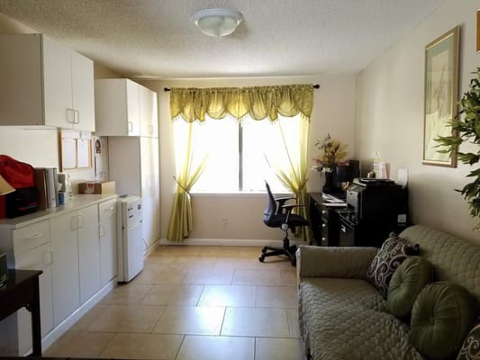 Bright interior of a resident common area with seating