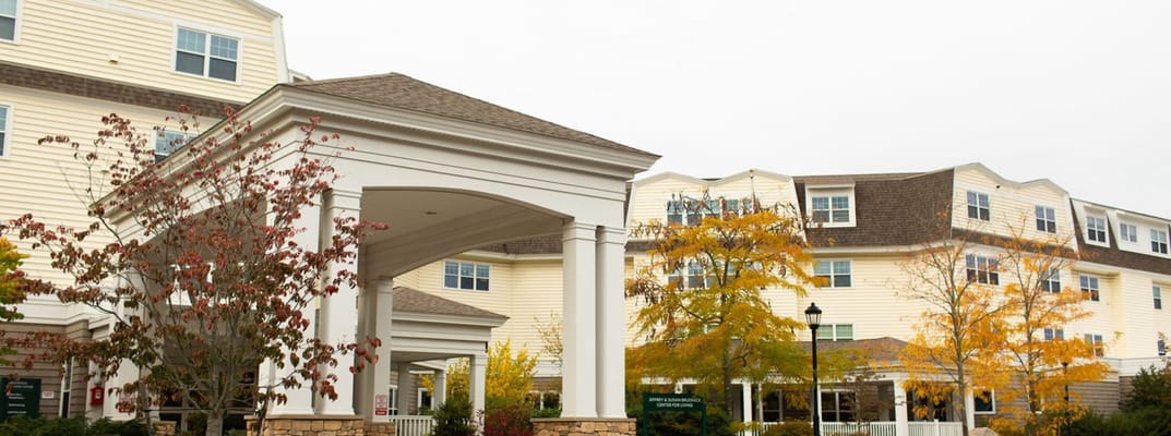 Building exterior of Cohen Florence Levine Estates with landscaping