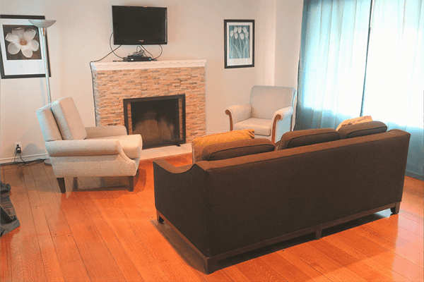 Common area with chairs and a fireplace