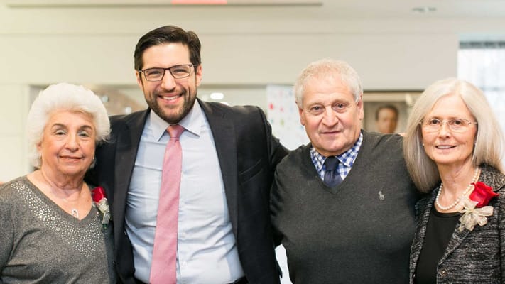 Residents and staff posing for a group photo