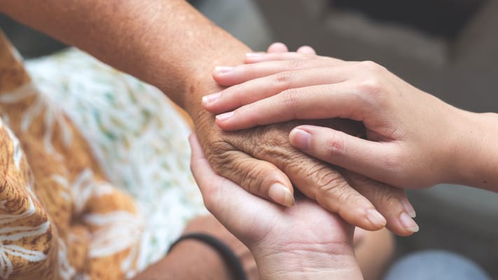 Close-up of hands showing connection and care