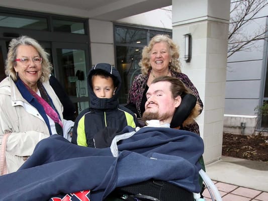 Residents and family enjoying time outdoors