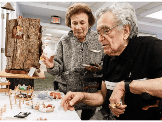 Residents engaging with a creative art display