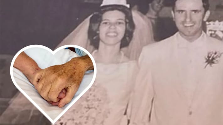 A couple celebrating their wedding and holding hands