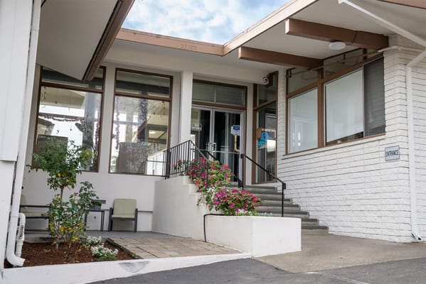 Entrance of East Bay Post-Acute Healthcare Center with flowers