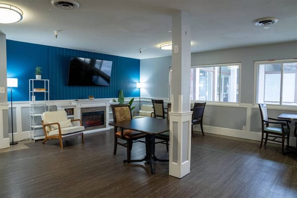Interior common area with seating and a fireplace