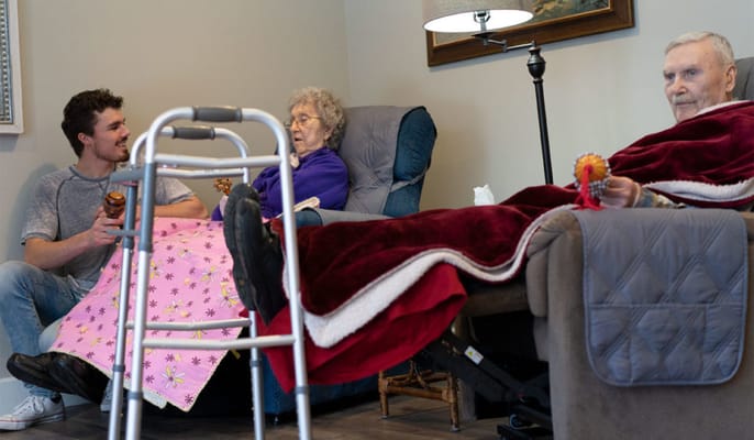 Residents chatting in a cozy common area