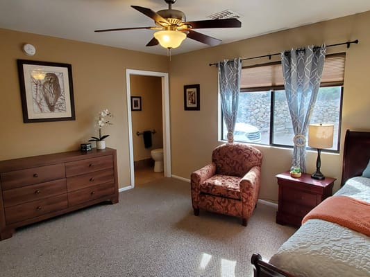 A cozy resident room with furniture and decor