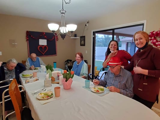 Residents enjoying a meal in a common area