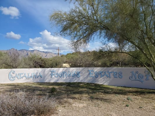 Outdoor view of a facility sign in a desert landscape