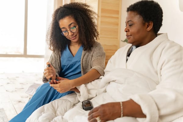 Healthcare worker assisting a resident with care