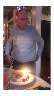 Resident celebrating with birthday dessert