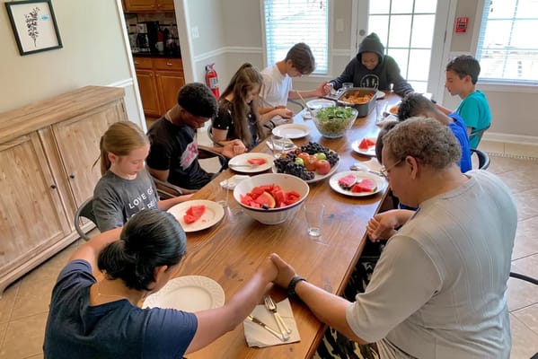 Residents enjoying a meal together in a communal dining space