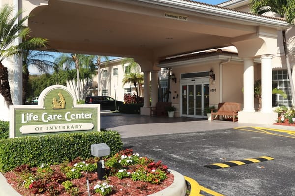 Entrance of Life Care Center at Inverrary with sign