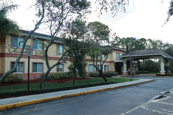 Exterior view of the facility with entrance and landscaping
