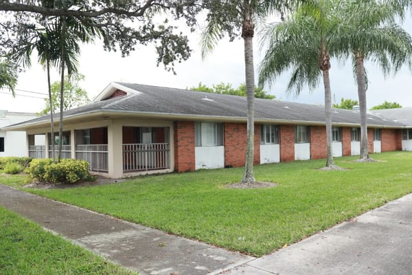 Exterior view of a residential building with grass