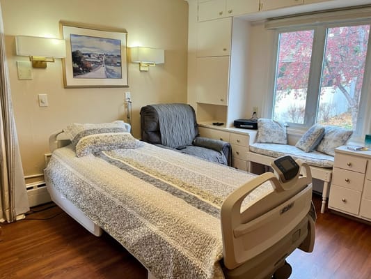 A well-furnished private resident room with natural light