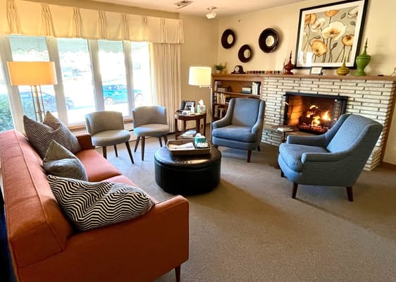 Cozy common area with a fireplace and seating