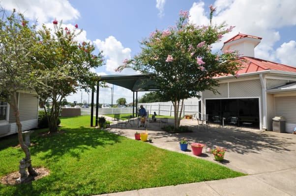Residents enjoying a garden area with seating