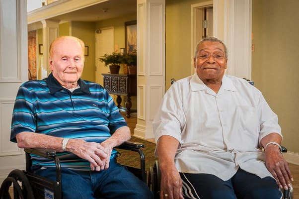 Two residents seated in a common area