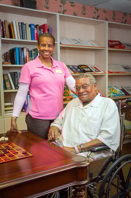 Staff member with a resident in a cozy common area