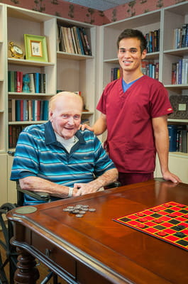 Staff member with a resident in the common area