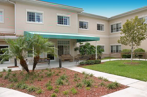 Outdoor area with seating and greenery near the facility