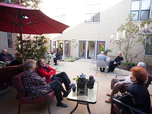 Residents enjoying time in a courtyard