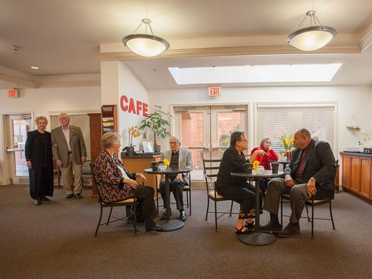 Residents socializing in a common area café