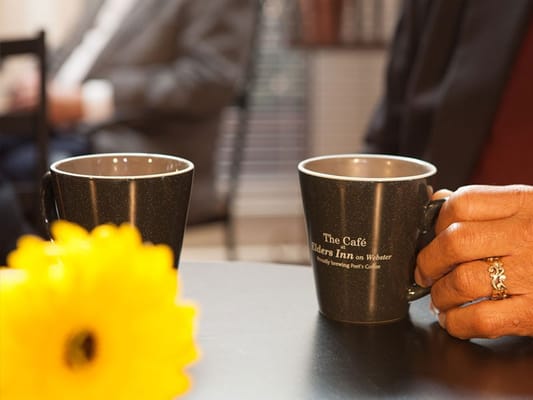 A close-up of coffee mugs in a common area